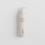 A tall, cylindrical pump bottle of Munster Clarifying Cleanser on a clean, light gray background.